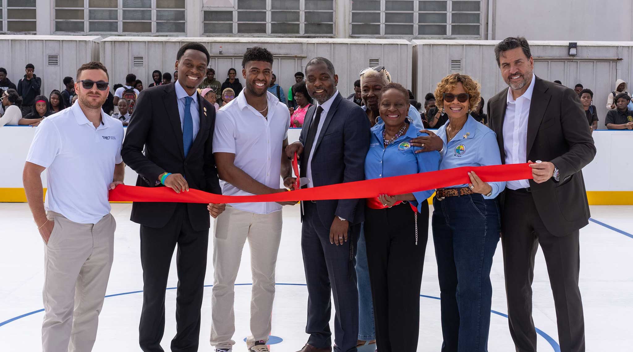 Ribbon-cutting ceremony at a new synthetic ice rink opening